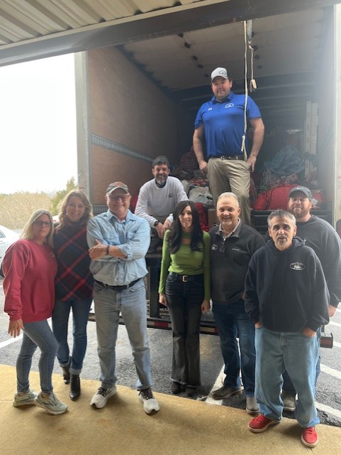 Unity4Kids team unloading donations from truck