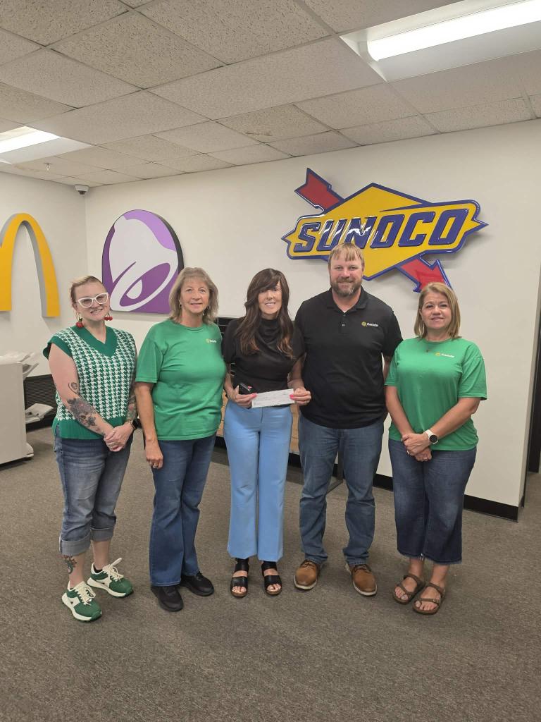 Unity4Kids team receiving a donation check